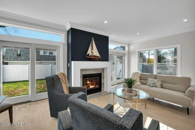 an empty room with a window and a ceiling fan