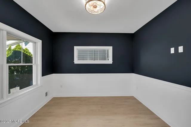 a kitchen with a stove a refrigerator and a fireplace