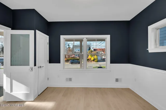 a living room with furniture a fireplace and kitchen view