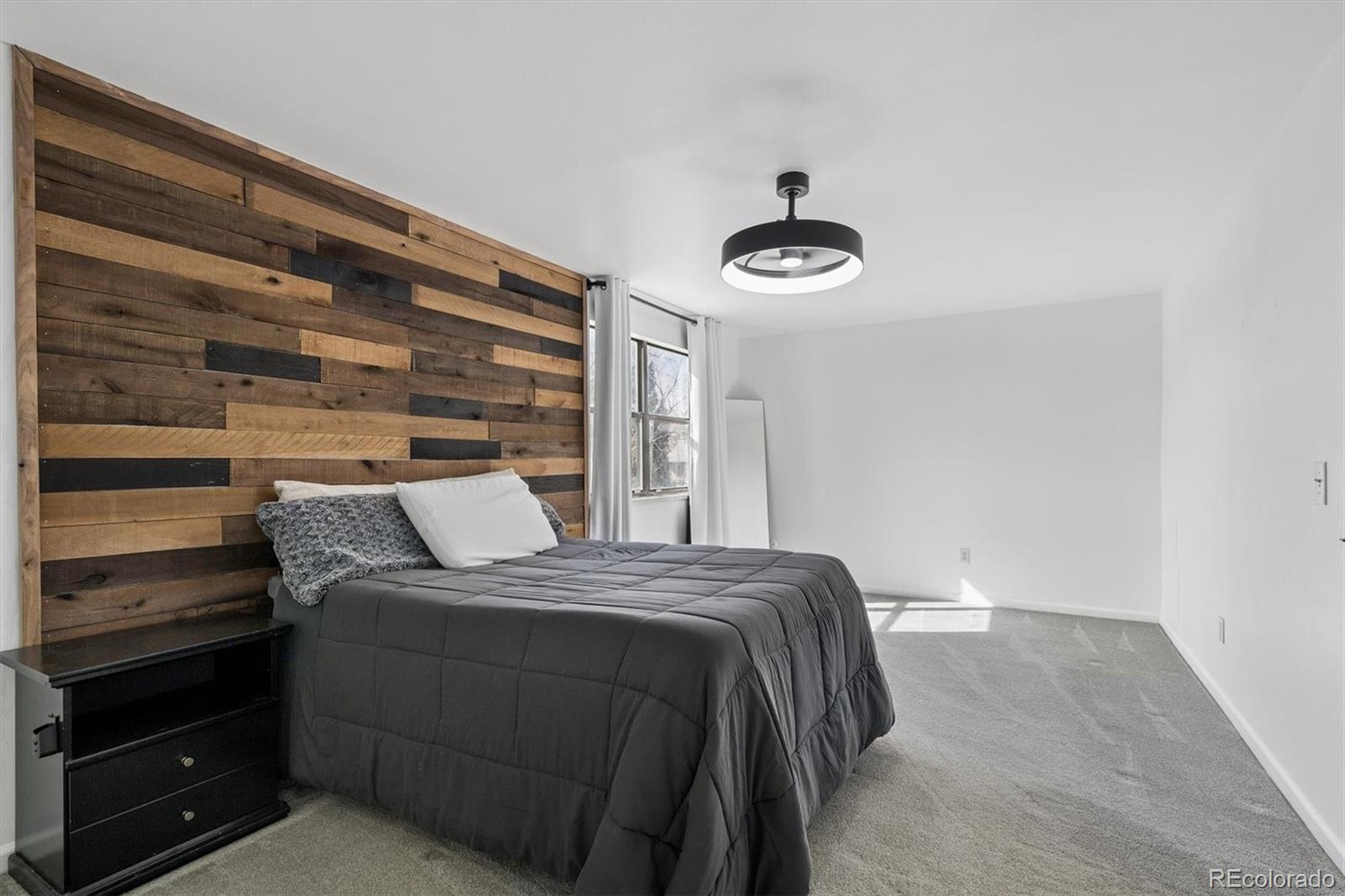 10433 Garrison Street Broomfield, CO 80021 - Photo 12 of 30 a bedroom with a bed and a window