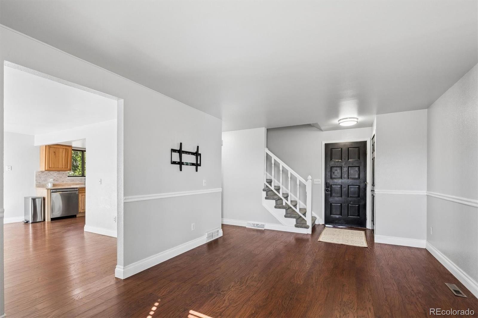 10433 Garrison Street Broomfield, CO 80021 - Photo 3 of 30 an entryway and livingroom with furniture