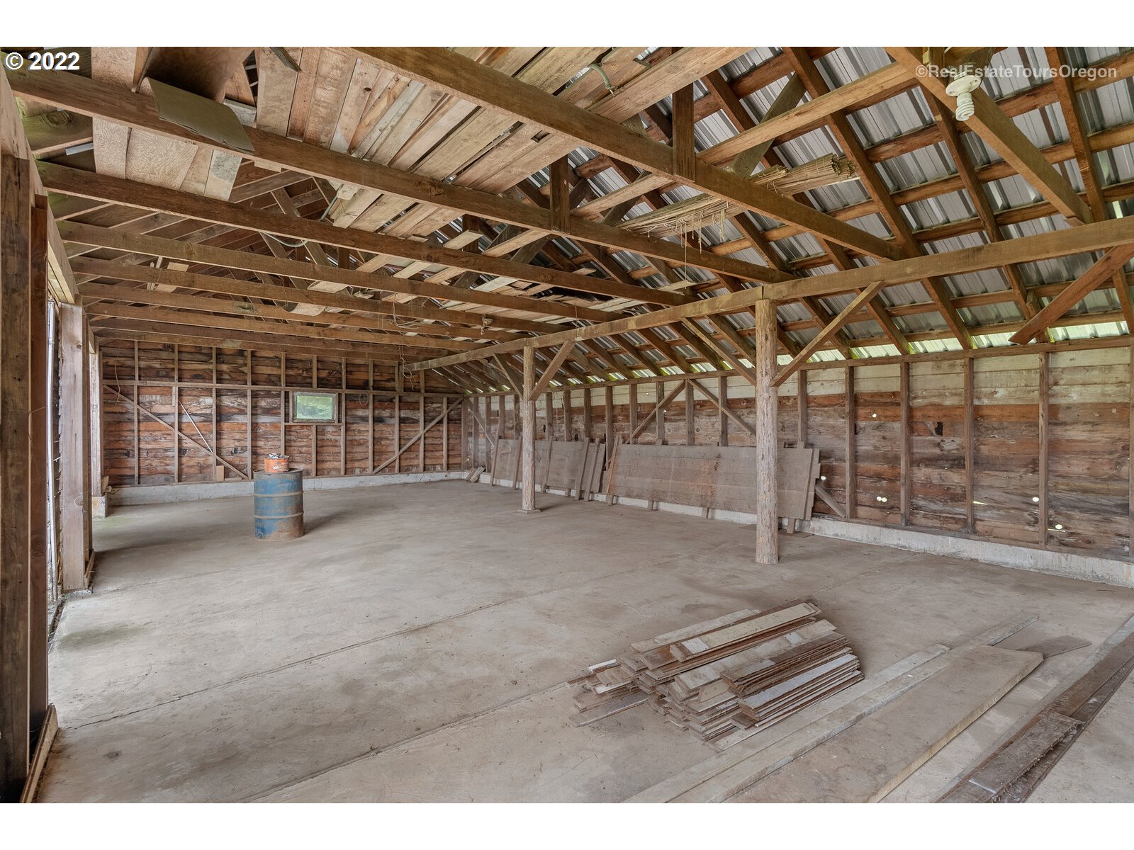 54795 Southwest Roberts School Road Gaston, OR 97119 - Photo 11 of 32 a view of an empty room with wooden walls