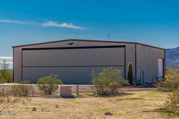 a very nice looking dining room with floor to ceiling window and glass door