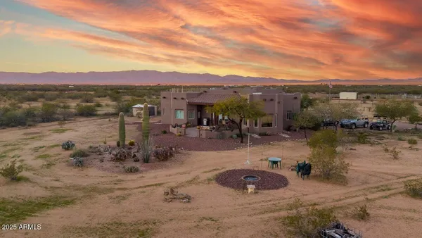 an aerial view of a house with a lake view