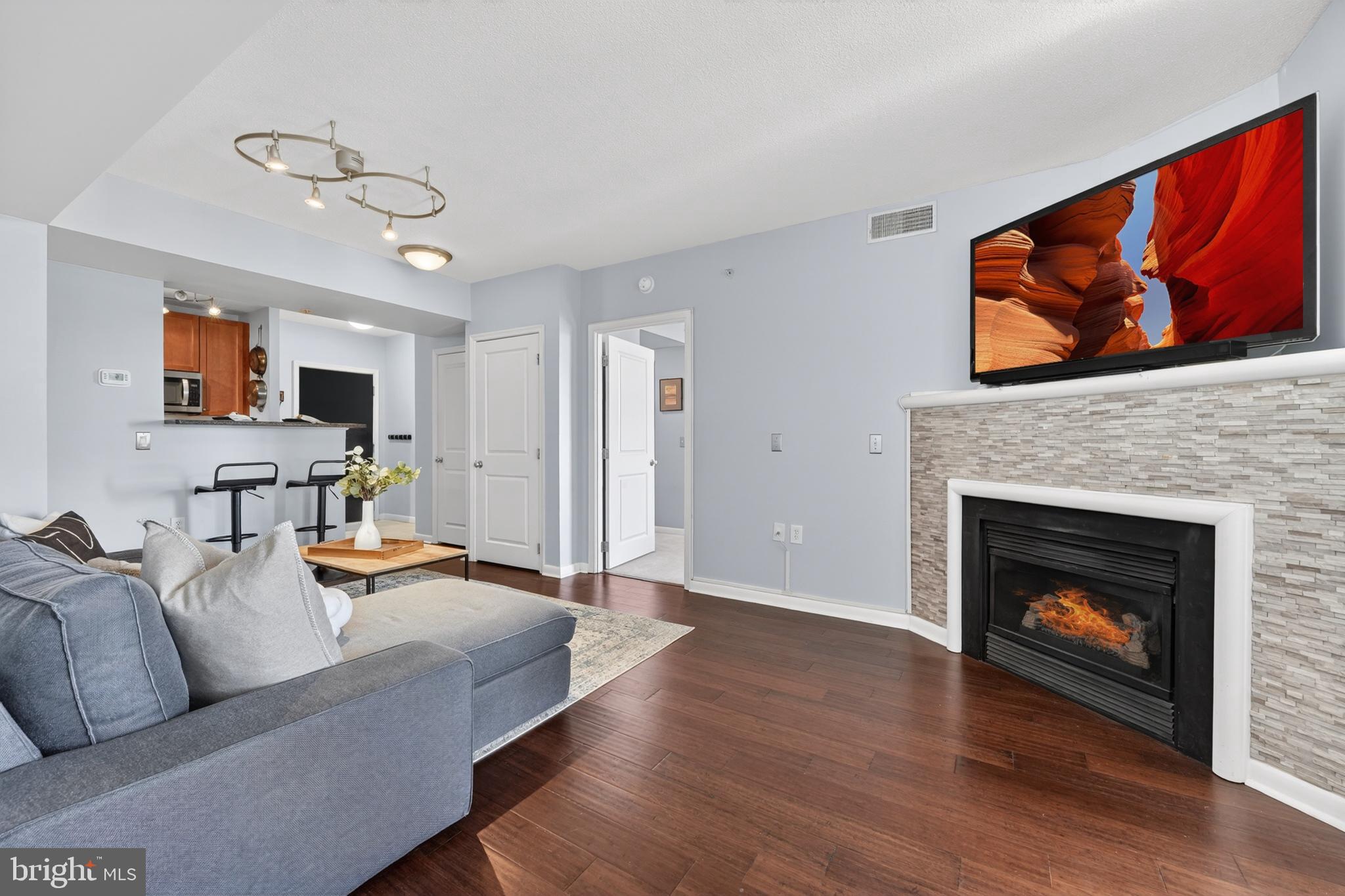 851 North Glebe Road, Unit 1301 Arlington, VA 22203 - Photo 17 of 84 Living Room -Hardwood Floors & Fireplace Views!