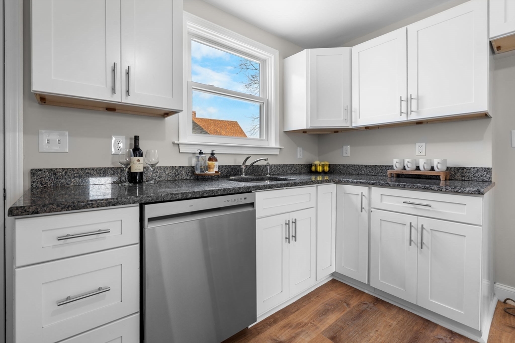 368 Read Street Somerset, MA 02726 - Photo 11 of 35 a kitchen with granite countertop white cabinets stainless steel appliances a sink and a window