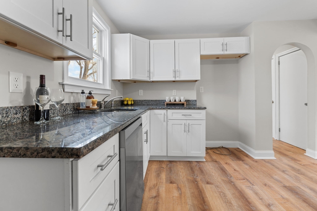368 Read Street Somerset, MA 02726 - Photo 12 of 35 a kitchen with stainless steel appliances granite countertop a sink stove and cabinets