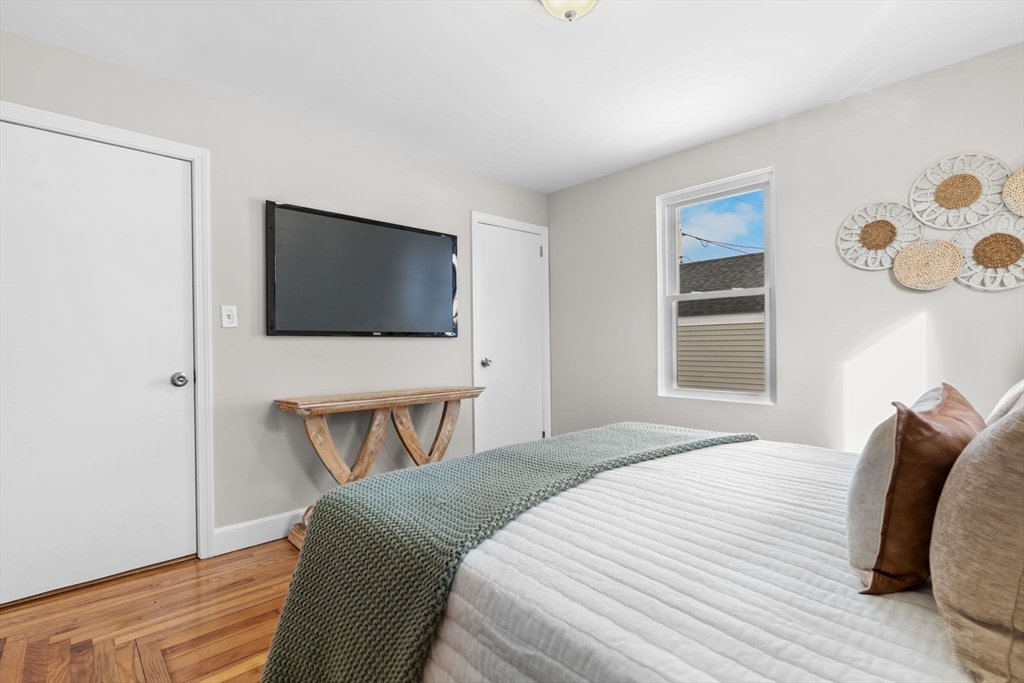368 Read Street Somerset, MA 02726 - Photo 13 of 35 a bedroom with a bed and a flat screen tv