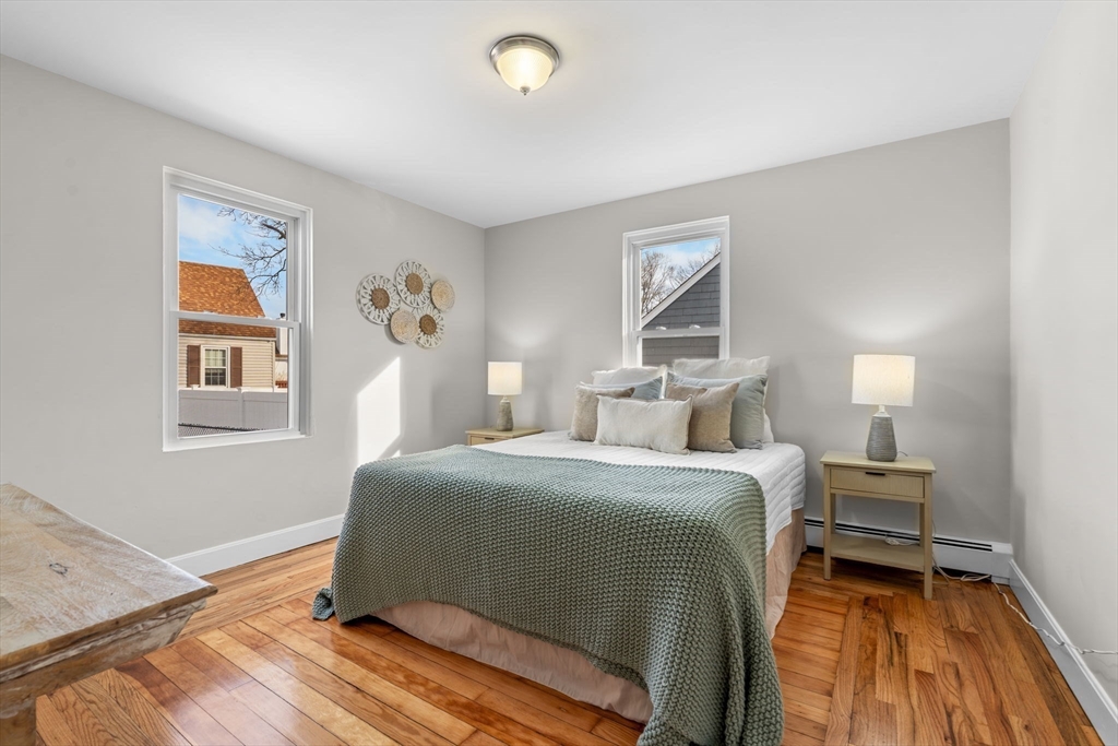 368 Read Street Somerset, MA 02726 - Photo 15 of 35 a bedroom with a bed and wooden floor