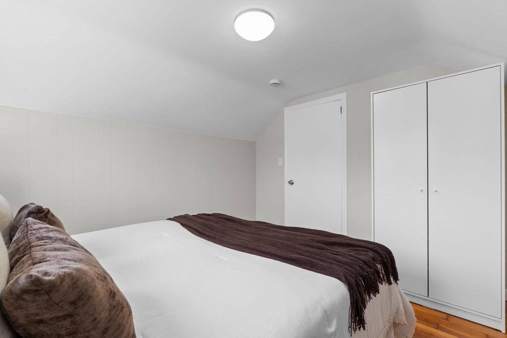 368 Read Street Somerset, MA 02726 - Photo 16 of 35 a bedroom with a bed and a lamp