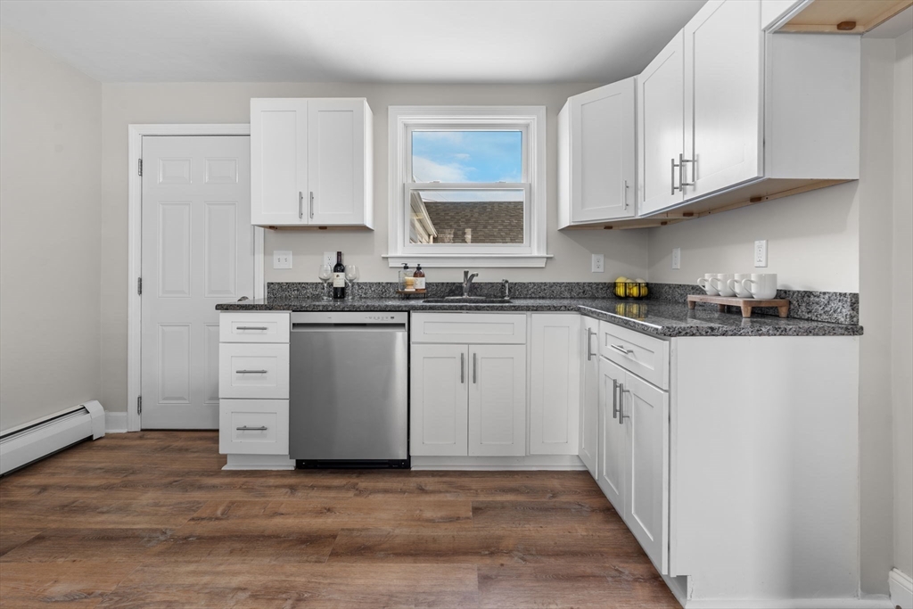 368 Read Street Somerset, MA 02726 - Photo 9 of 35 a kitchen with white cabinets stainless steel appliances and sink