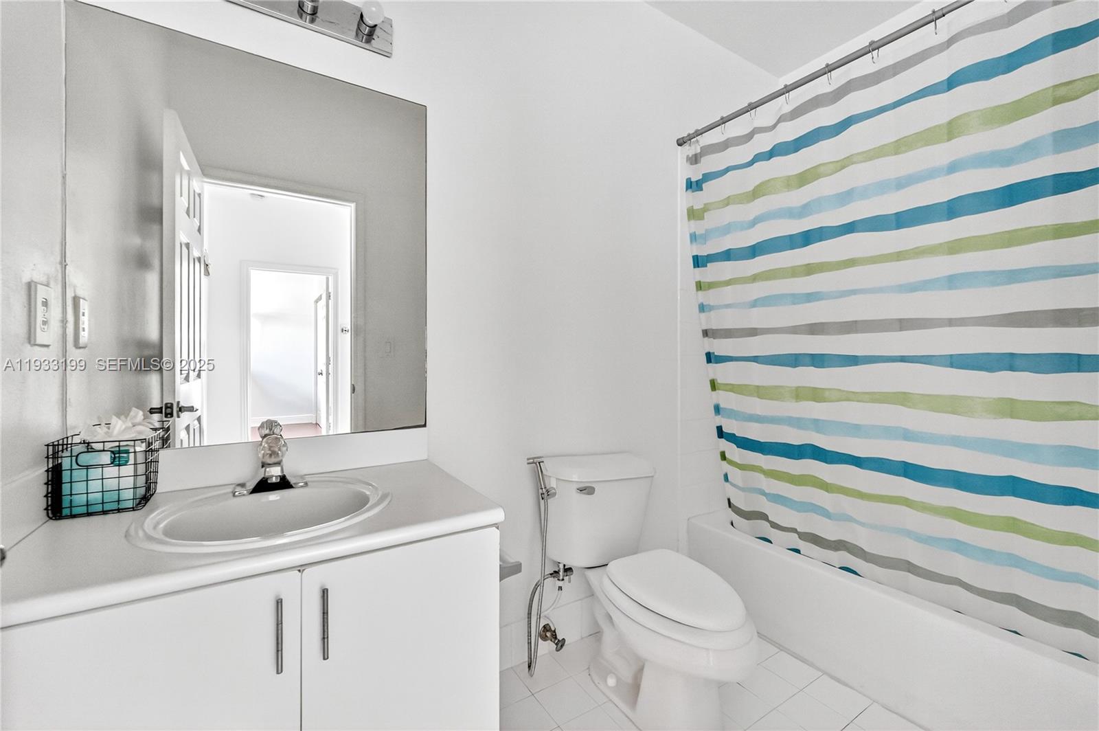 10934 Southwest 247th Terrace Homestead, FL 33032 - Photo 16 of 28 a bathroom with a sink toilet and shower