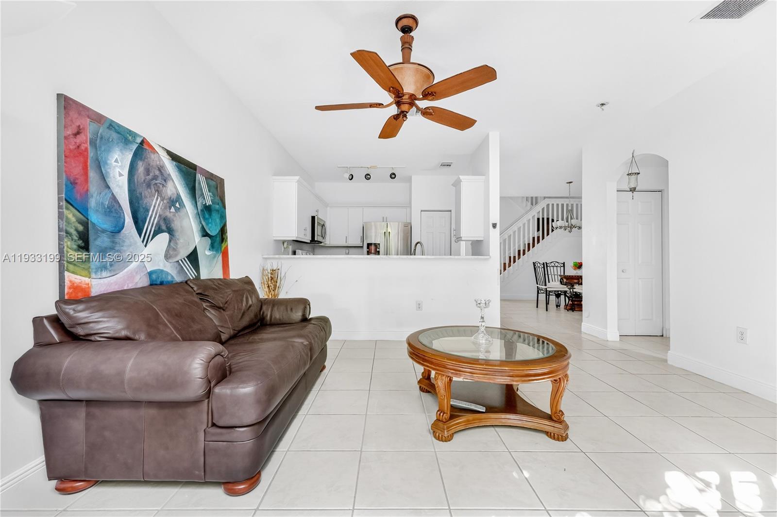 10934 Southwest 247th Terrace Homestead, FL 33032 - Photo 6 of 28 a living room with furniture and a wooden floor
