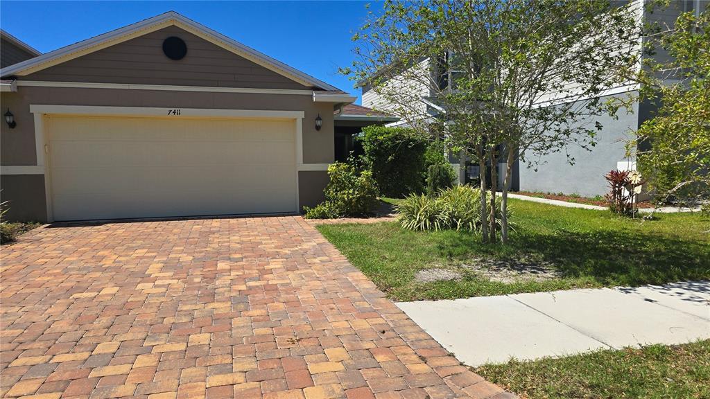 Undisclosed Address Gibsonton, FL 33534 - Photo 1 of 1 a front view of a house with a yard
