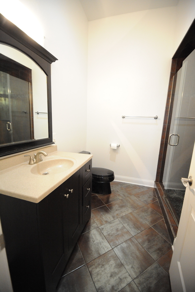 2903 West Irving Park Road, Unit 1 Chicago, IL 60618 - Photo 3 of 15 a bathroom with a sink vanity and a mirror