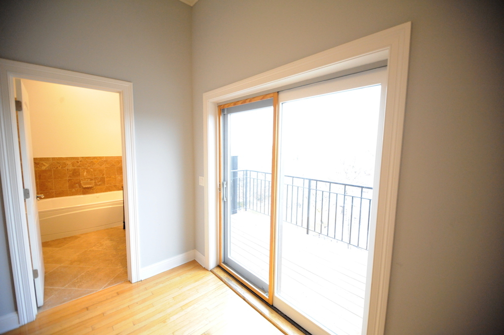2903 West Irving Park Road, Unit 1 Chicago, IL 60618 - Photo 4 of 15 a view of an empty room and window