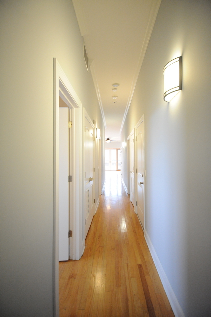 2903 West Irving Park Road, Unit 1 Chicago, IL 60618 - Photo 6 of 15 a view of a hallway with wooden floor