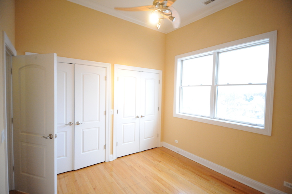 2903 West Irving Park Road, Unit 1 Chicago, IL 60618 - Photo 7 of 15 a view of an empty room with a window