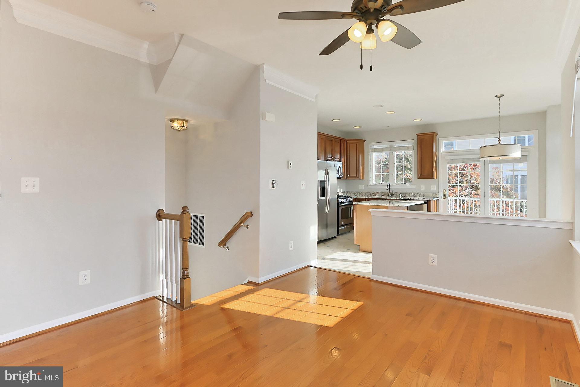 42634 Pine Forest Drive Chantilly, VA 20152 - Photo 8 of 47 a living room with stainless steel appliances kitchen island granite countertop furniture and a kitchen view