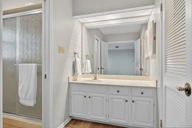 a en suite bathroom with a sink and mirror