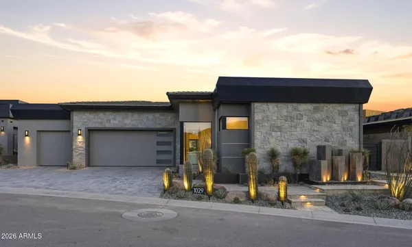 a view of a house with a parking space