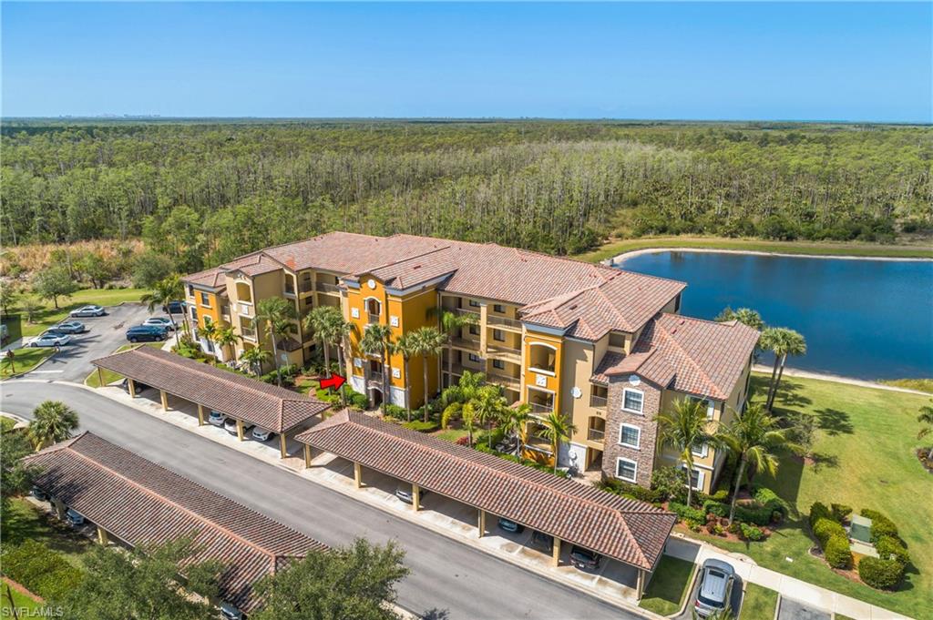 9719 Acqua Court, Unit 214 Naples, FL 34113 - Photo 30 of 50 an aerial view of residential houses with outdoor space