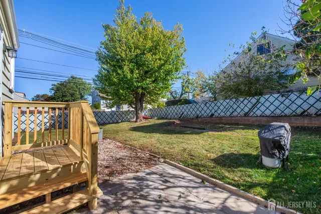 a view of a yard with potted plants