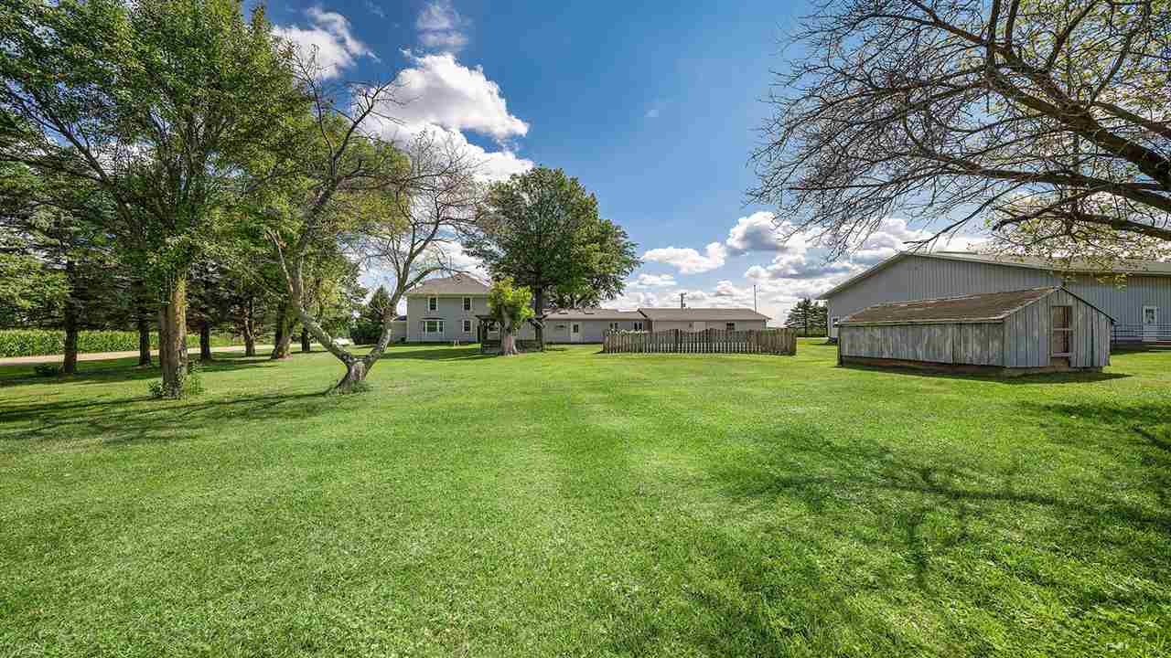 1652 South Columbian Road Oregon, IL 61061 - Photo 39 of 40 a view of a house with backyard and a tree
