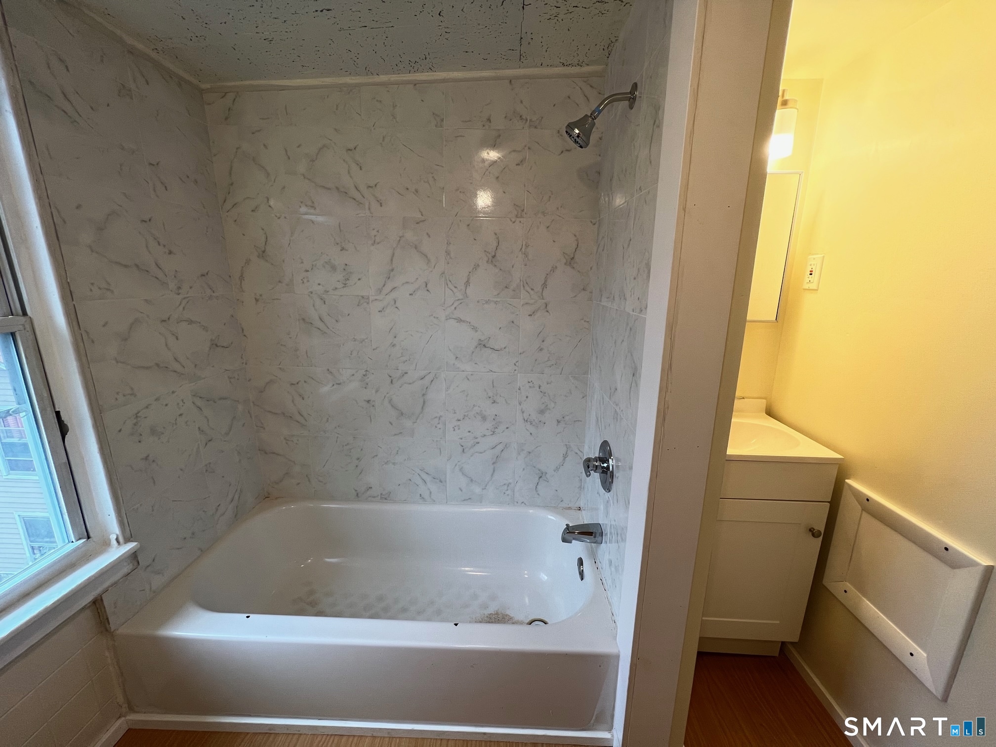 62 North Leonard Street Waterbury, CT 06708 - Photo 11 of 13 a bathroom with a bathtub