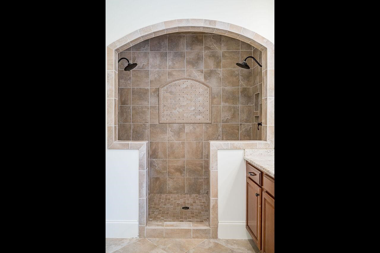 3820 Laurel Hills Road Raleigh, NC 27612 - Photo 17 of 30 Walk in shower with dual shower heads take this bathroom to a sophisticated level! Owner's Bath
