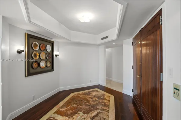 a view of an entryway with wooden floor