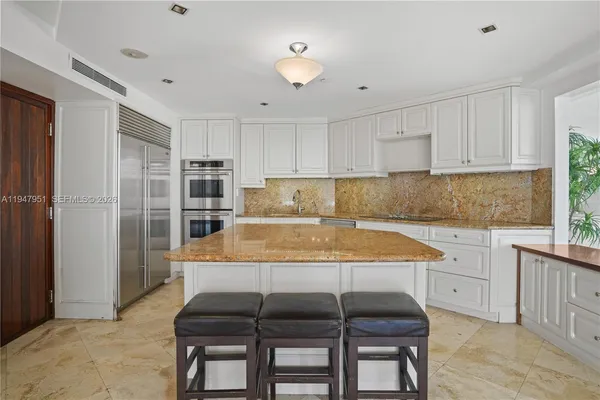 a bedroom with a bed and a night stand