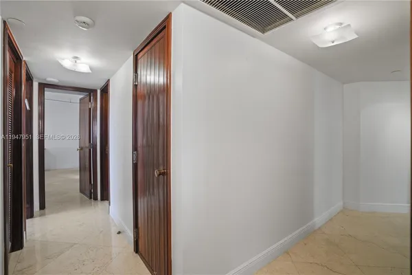 a spacious bedroom with a bed and a table