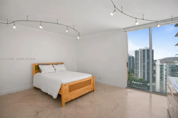 a bathroom with a toilet a sink and a large mirror