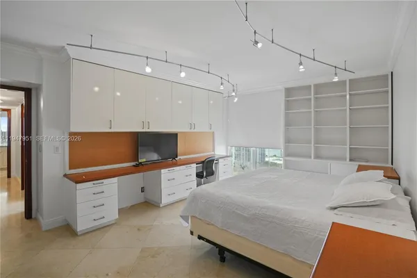a bathroom with a bathtub shower and a sink
