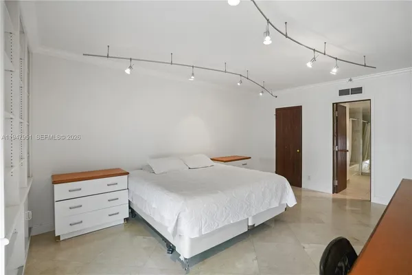 a bathroom with a toilet sink and shower