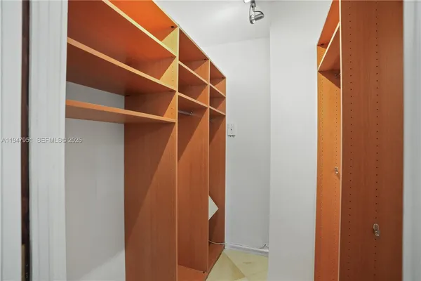 a room with pool table and chairs