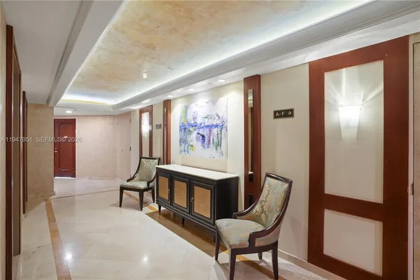 a view of a room with furniture and a potted plant