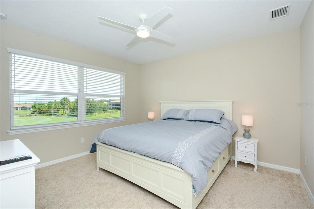 13737 Messina Loop, Unit 202 Lakewood Ranch, FL 34211 - Photo 24 of 49 a bed sitting in a bedroom next to a window
