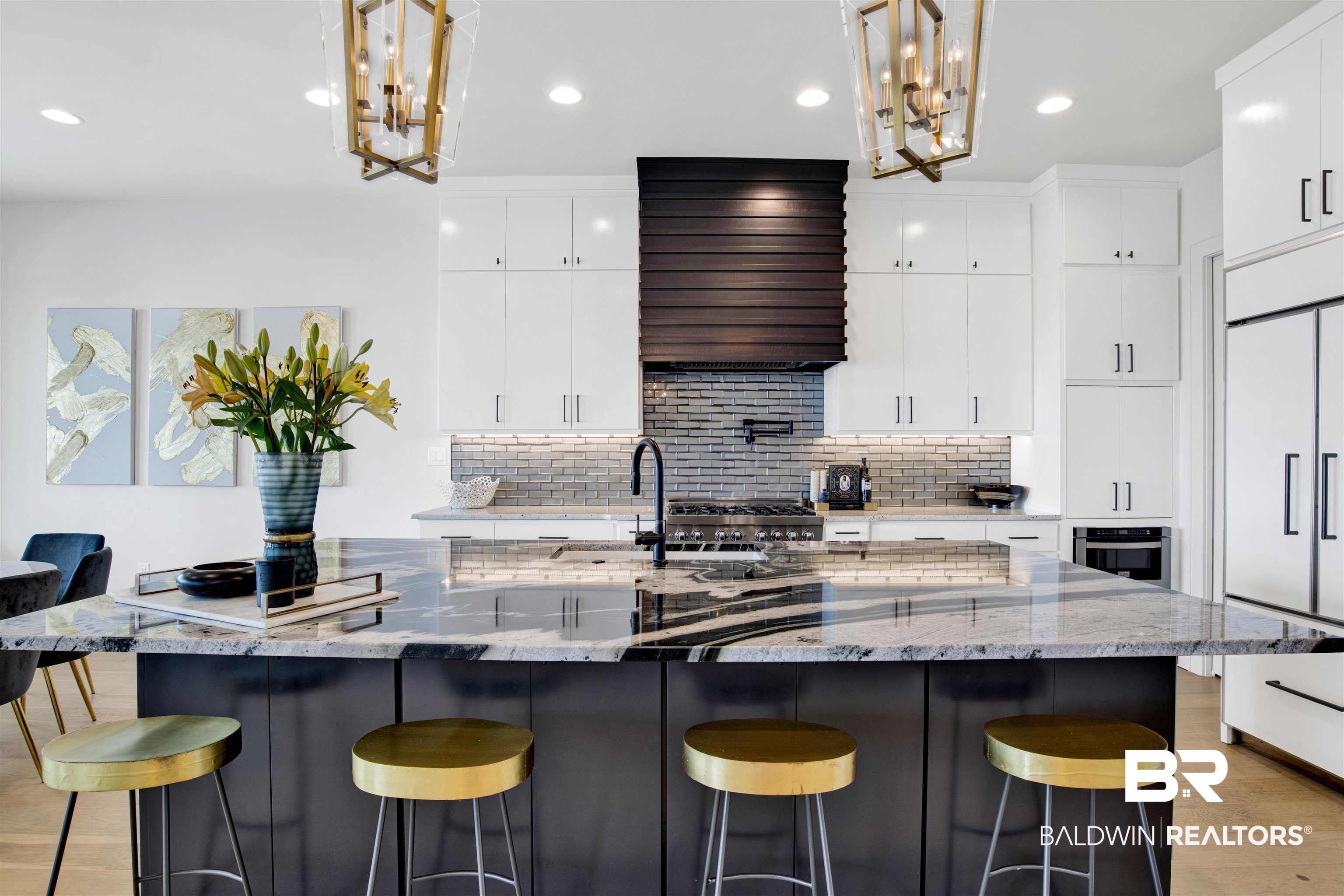 30239 Canal Court Orange Beach, AL 36561 - Photo 19 of 70 Kitchen with a breakfast bar area, a chandelier, tasteful backsplash, and recessed lighting