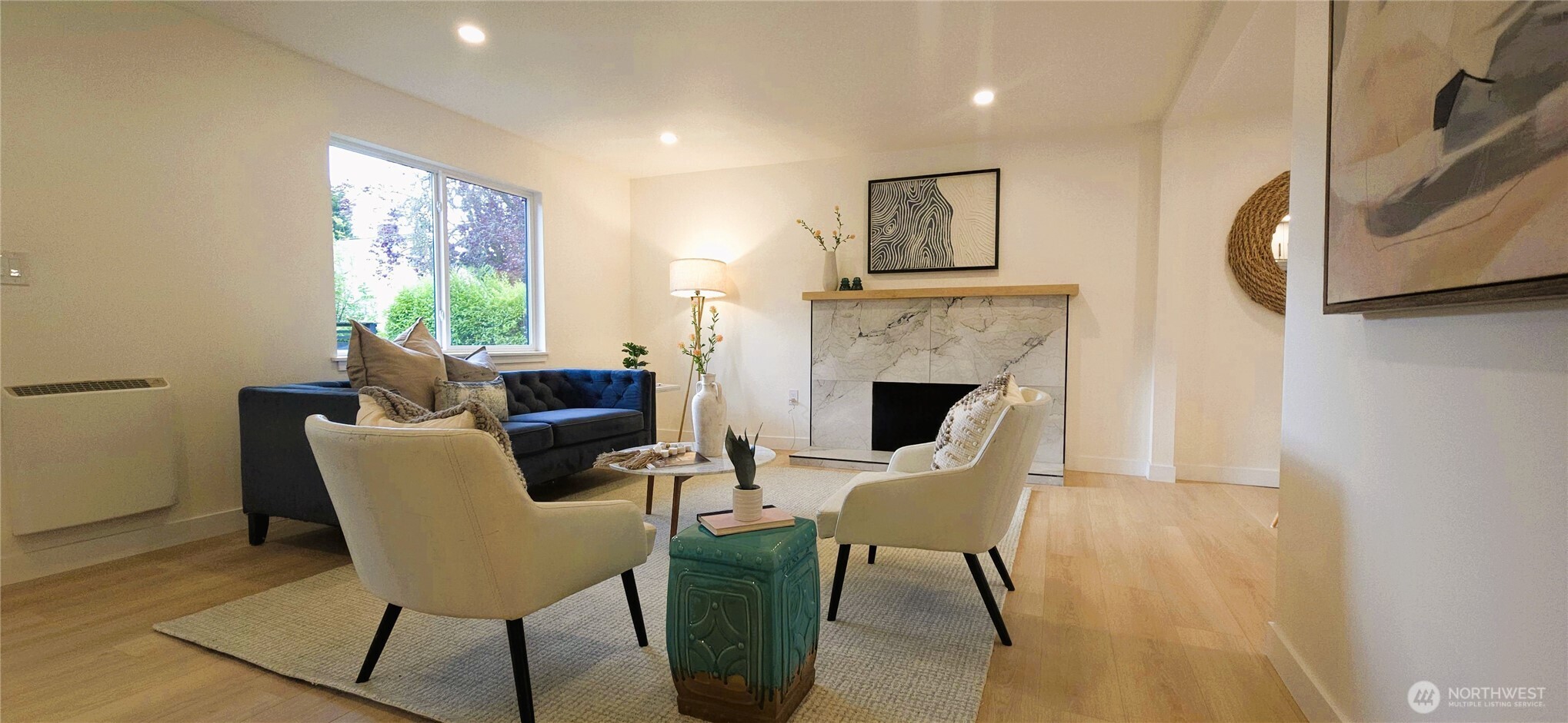 8421 39th Avenue Southwest Seattle, WA 98136 - Photo 4 of 24 a dining room with furniture a fireplace and wooden floor