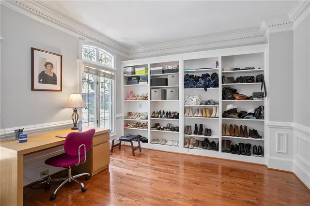 a view of a livingroom with furniture and bookshelf