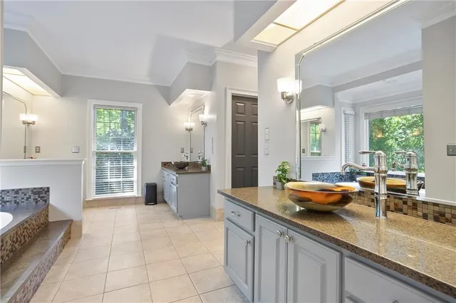 a kitchen with stainless steel appliances granite countertop a sink and a counter