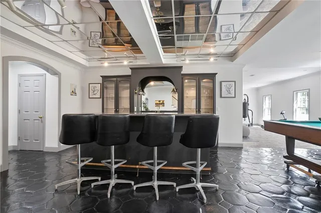 a living room with a couch and a chandelier