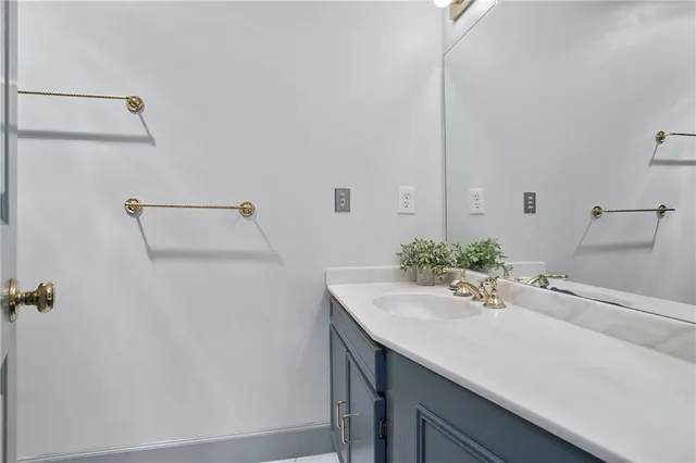 a bathroom with a sink and mirror