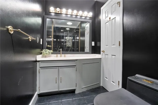 a bathroom with a sink double vanity and a mirror