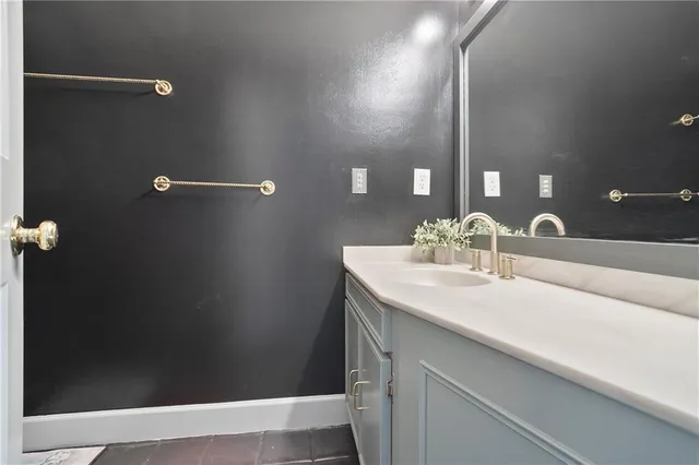 a bathroom with a sink and mirror