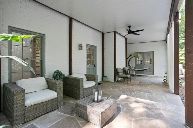 a view of a backyard with sitting area