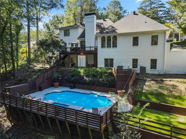 a view of a yard with potted plants