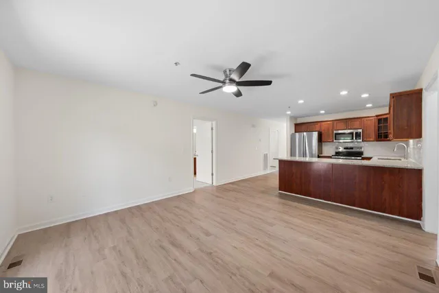 a view of kitchen with wooden floor and window